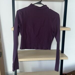 Lululemon cropped long sleeve in good used condition, no tag, PTP about 16”